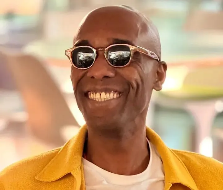 Marcus Chocollate smiling, dressed in yellow.